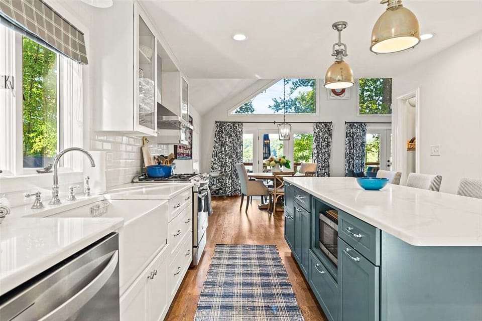 Open concept kitchen, living room, and dining area with a beautiful view.
