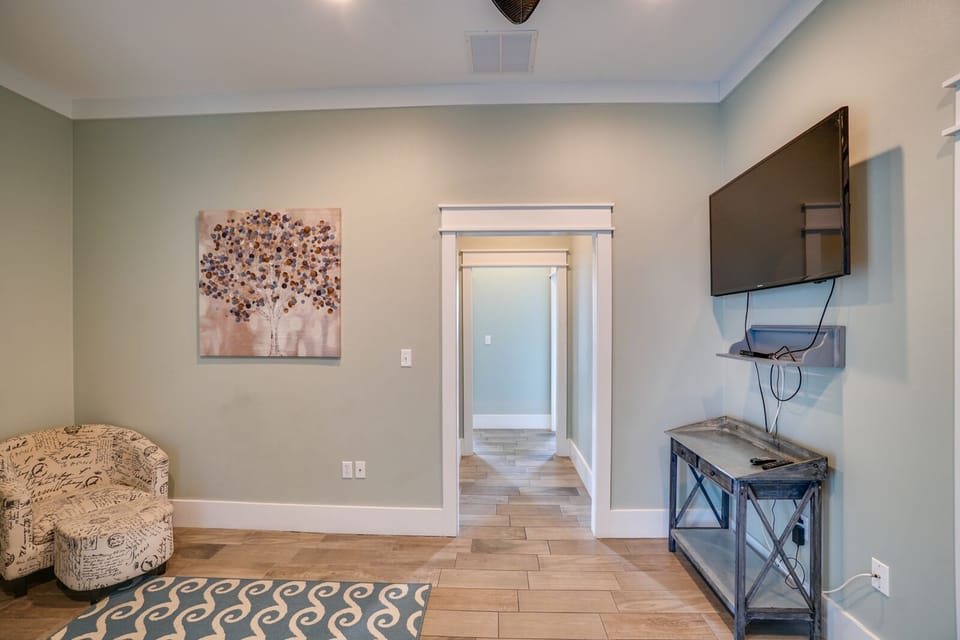 Unwind in your cozy living space with soft lighting, comfortable seating, and entertainment ready for your relaxing evenings.