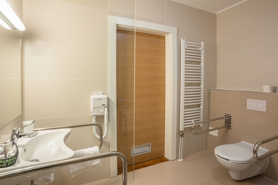 Family room disability access | Bathroom | Hair dryer, bathrobes, slippers, towels