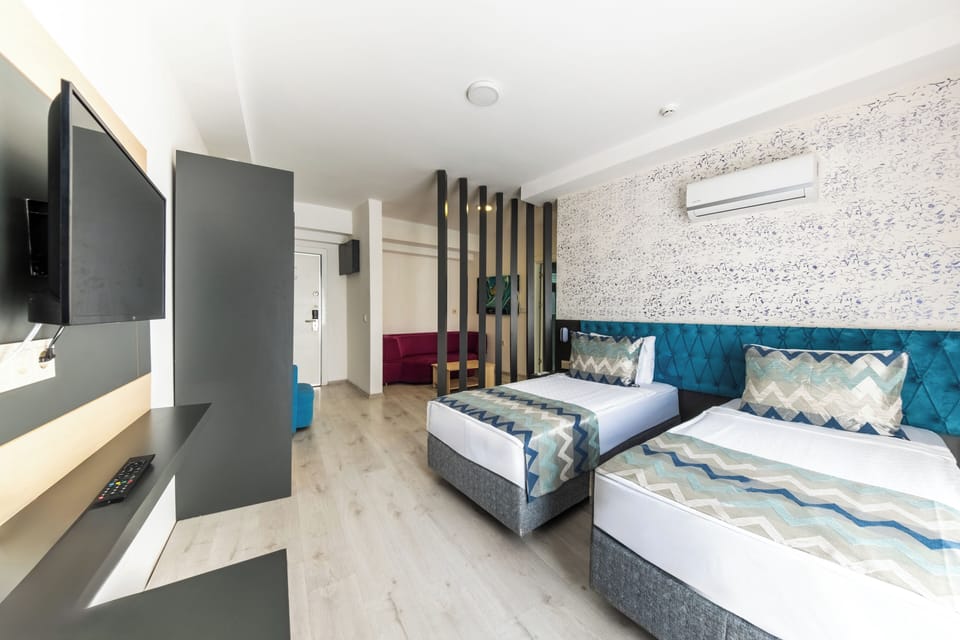 Family Room, 2 Bedrooms (4+1) | Minibar, in-room safe, free cribs/infant beds, free WiFi