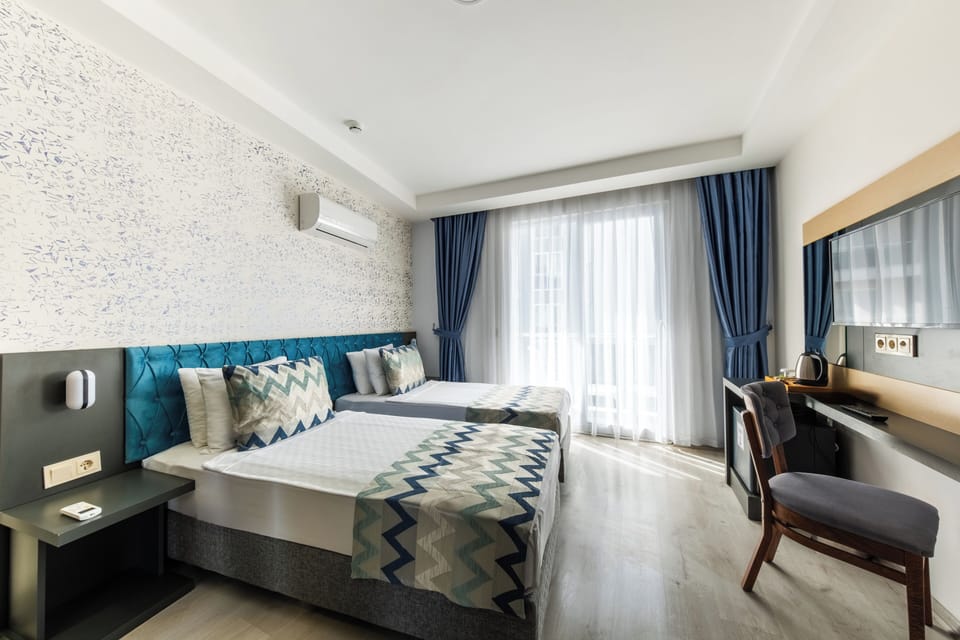 Family Room, 2 Bedrooms (4+1) | Minibar, in-room safe, free cribs/infant beds, free WiFi