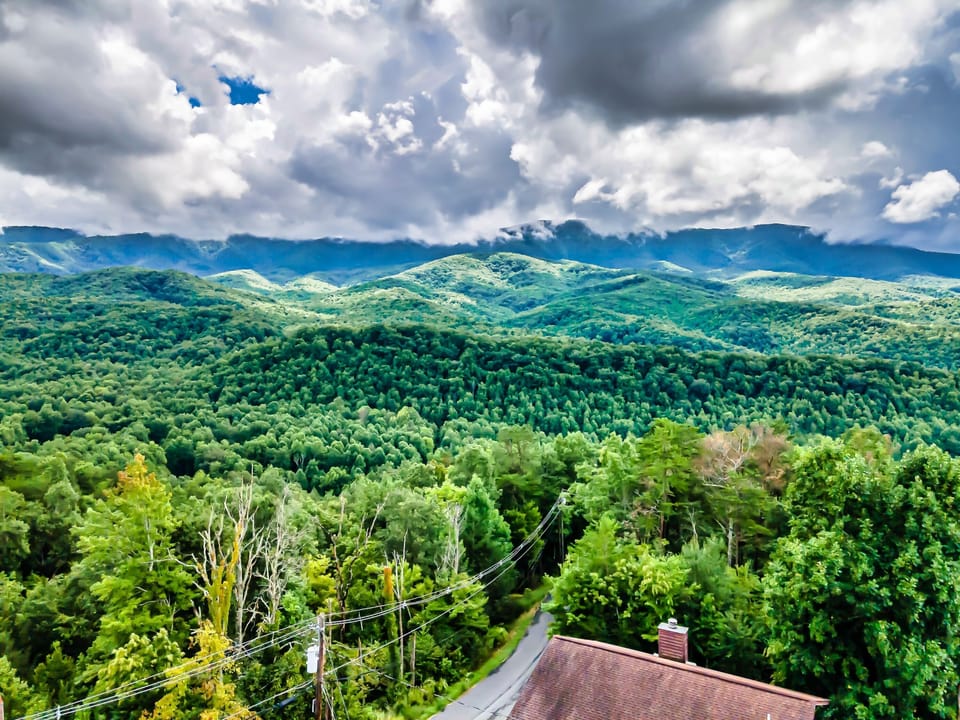 Rugged peaks play hide-&-seek with soft, rolling clouds at "Bear Bottom" cabin. 