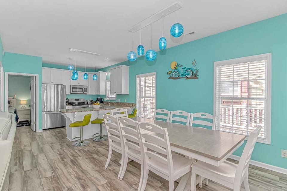 Dining room seats 8.  Kitchen beyond dining table and family room to the left