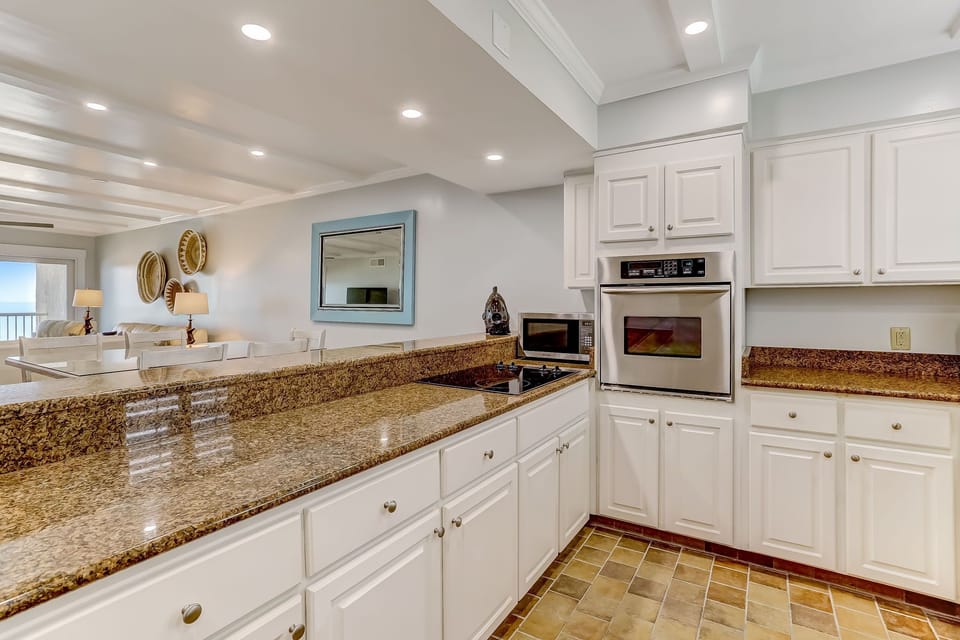 Fully Equipped Kitchen with Granite Countertops, Stainless Steel Appliances, and Gorgeous Ocean Front Views