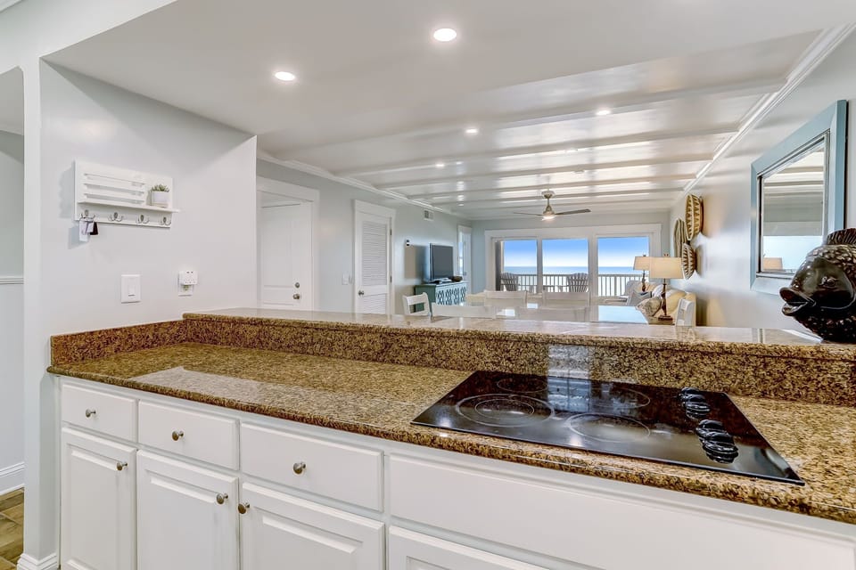 Fully Equipped Kitchen with Granite Countertops, Stainless Steel Appliances, and Gorgeous Ocean Front Views