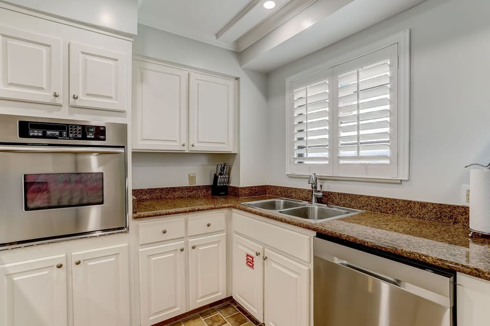 Fully Equipped Kitchen with Granite Countertops, Stainless Steel Appliances, and Gorgeous Ocean Front Views