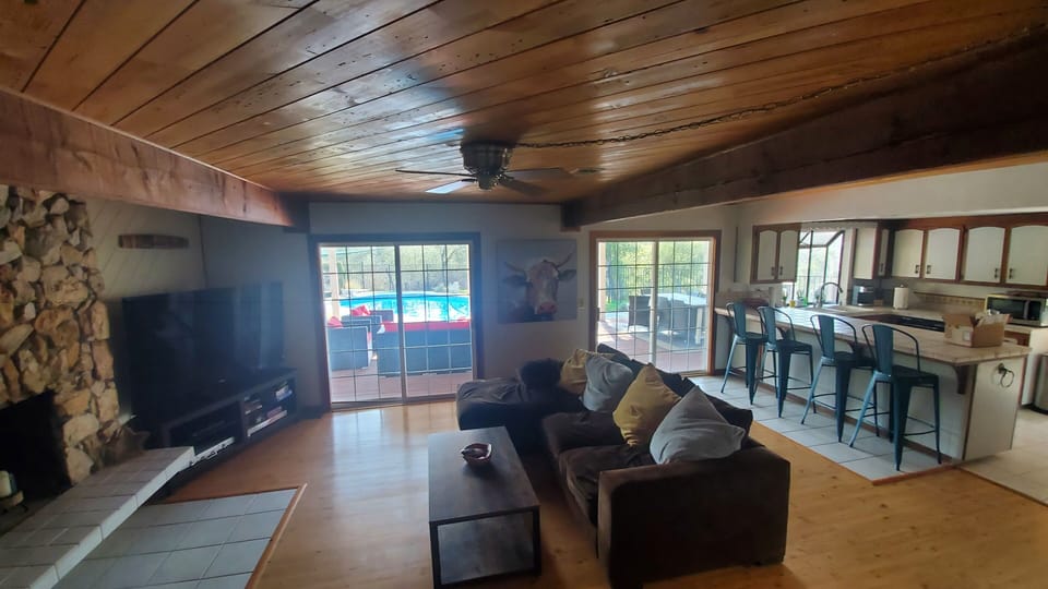 The 2nd living room/TV room opens to the deck and pool.