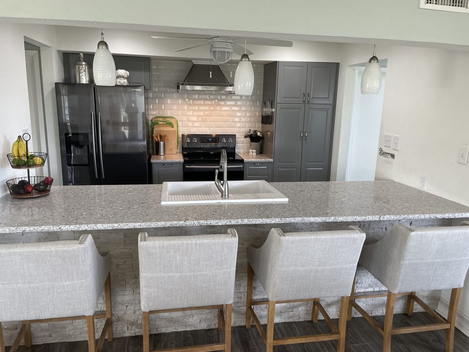 Chef's kitchen with bar seating for 4.