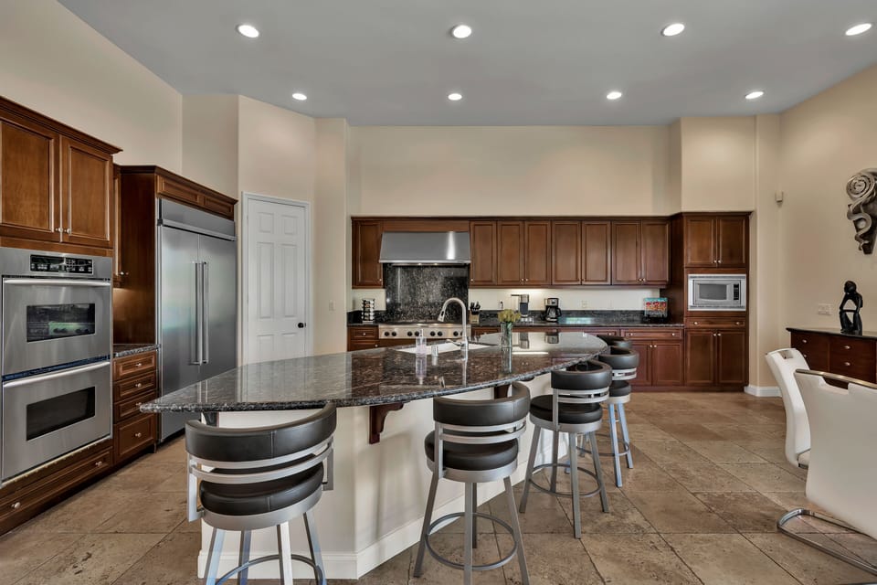 Kitchen with island seating for five.