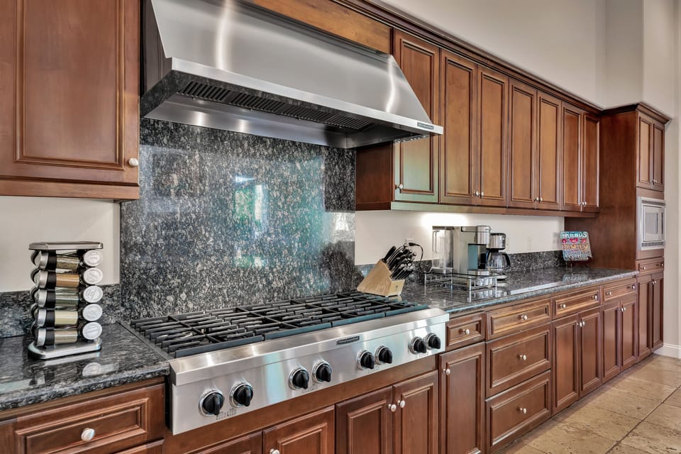 Kitchen with 6 burner gas stove.