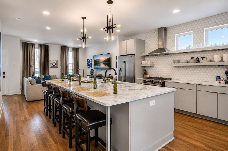 Spacious, fully stocked kitchen with a five-seat island, perfect for cooking, dining, and gathering during your Nashville stay.