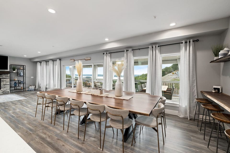 You’ll find numerous dining options, including this table for 16 and barstool set up adjacent to the coffee station.