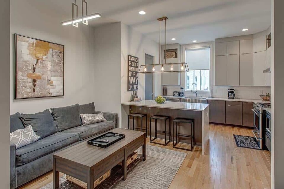 Contemporary open-concept living space with a thoughtfully connected kitchen and lounge, perfect for relaxing and entertaining.