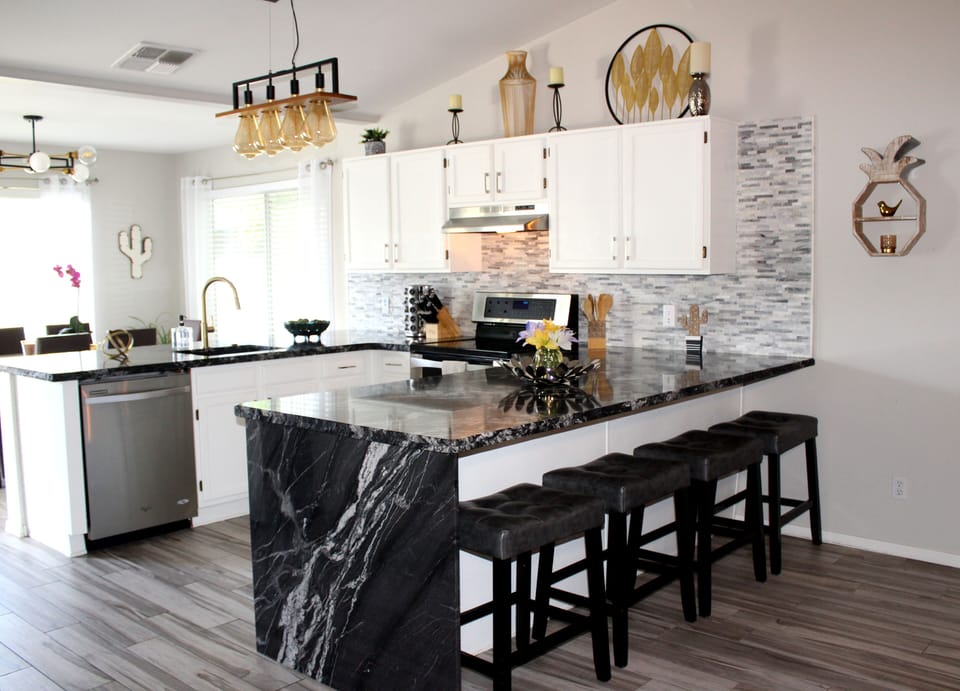 Updated kitchen with additional breakfast bar seating seating 
