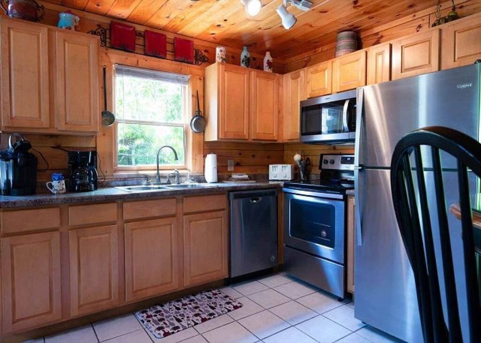 Full kitchen with stainless steel appliances
