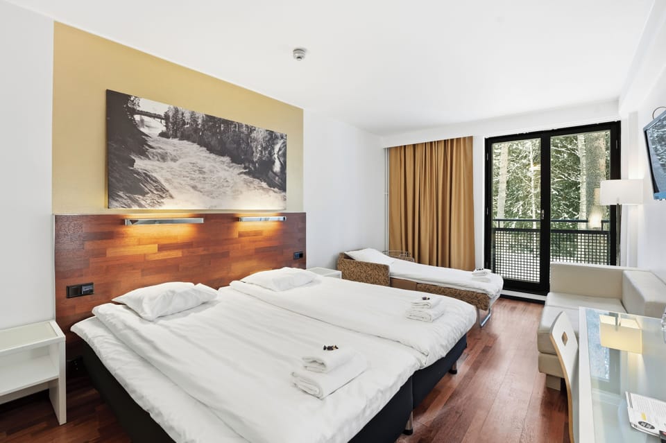 Standard Triple Room (Spa Building) | Desk, laptop workspace, blackout drapes, free WiFi