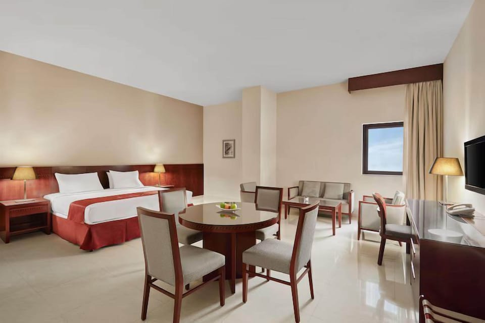 Junior Suite | Living area | 55-inch Smart TV with cable channels