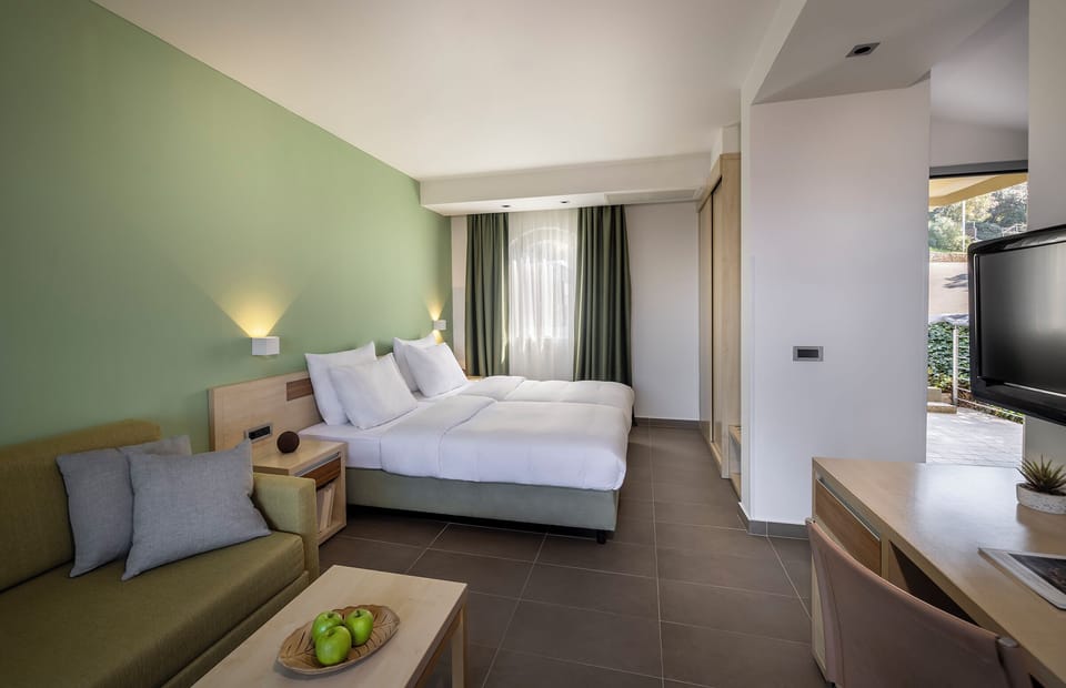 Premium Triple Room, Balcony | In-room safe, desk, free cribs/infant beds, free WiFi