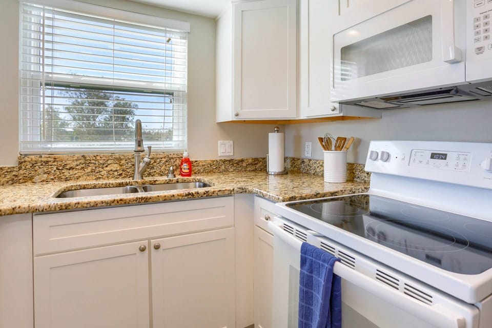 Bright White Kitchen with Granite Countertops
