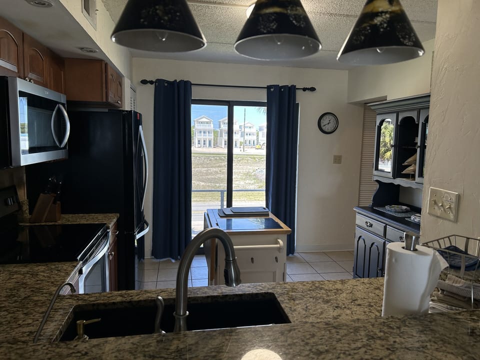 Bar area looking though kitchen to back deck