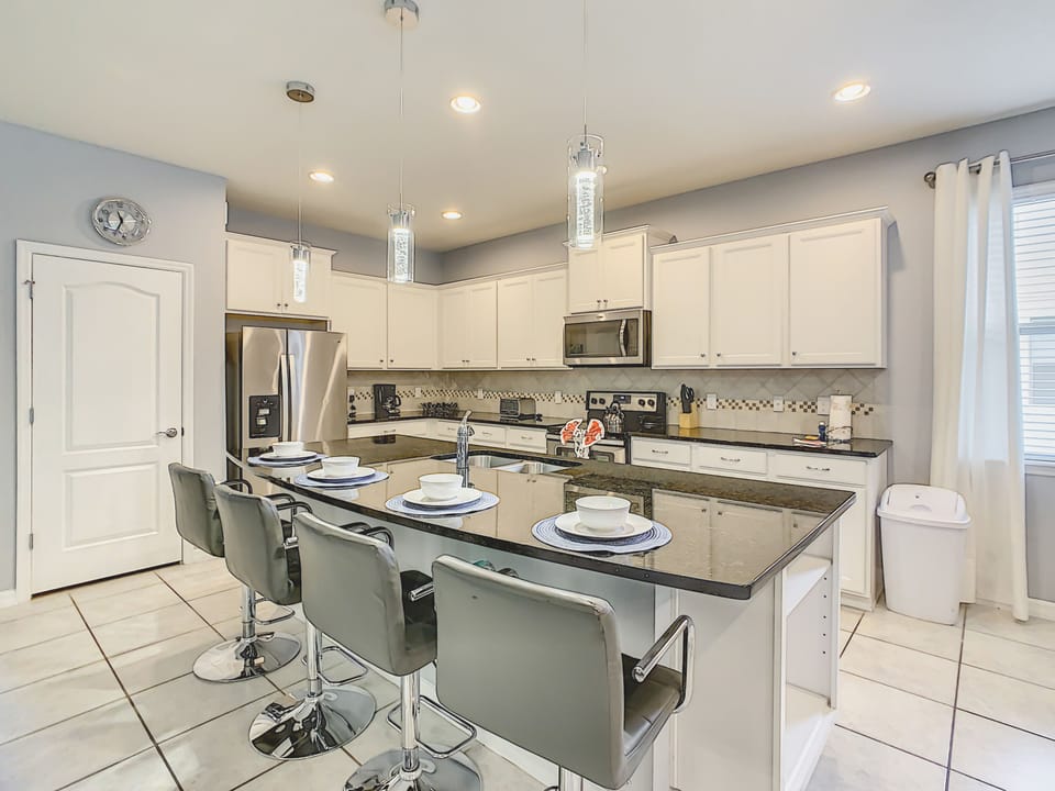 Breakfast Bar And Full Modern Kitchen