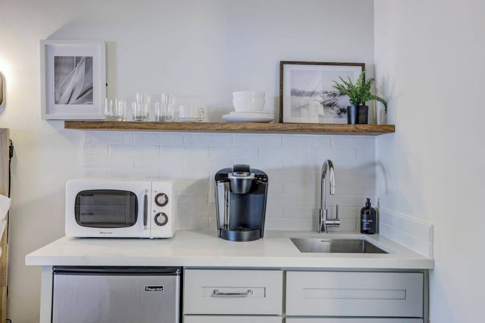 Compact kitchenette: Keurig, microwave, mini fridge. No stove.