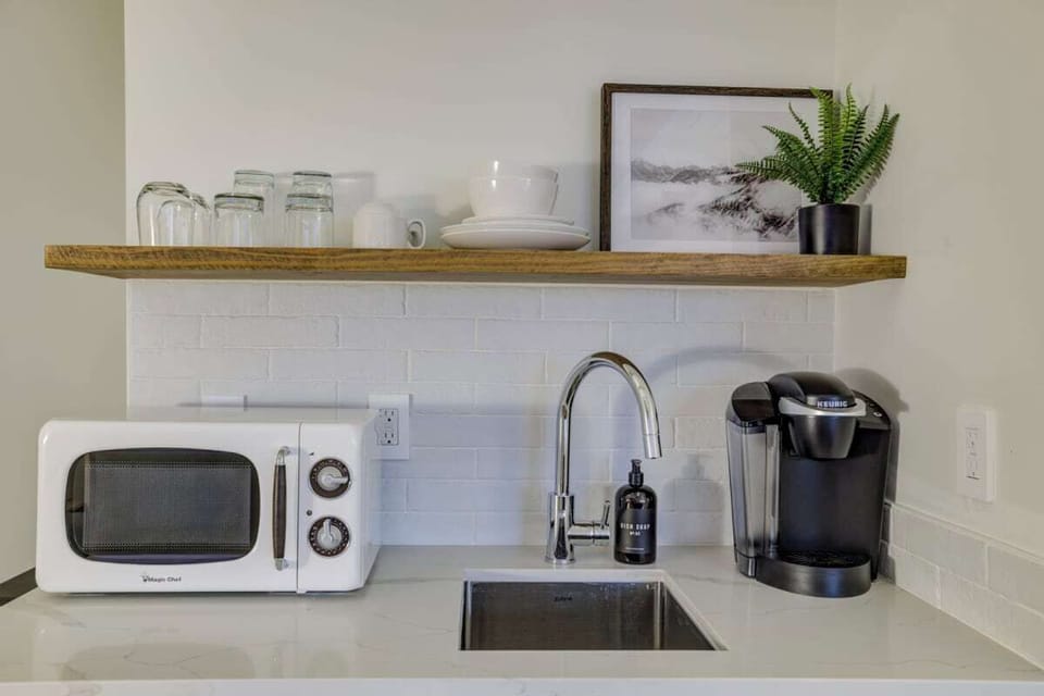 Compact kitchenette: Keurig, microwave, mini fridge. No stove.