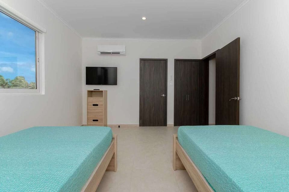 Second bedroom with TV, ensuite bathroom and walk-in closet