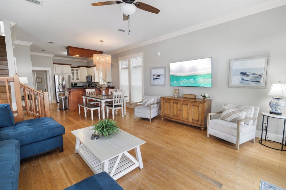 Step into your open-concept retreat, where coastal charm meets comfort. Relax in the airy living space with vaulted ceilings, or gather around the dining table for memorable meals with your crew.