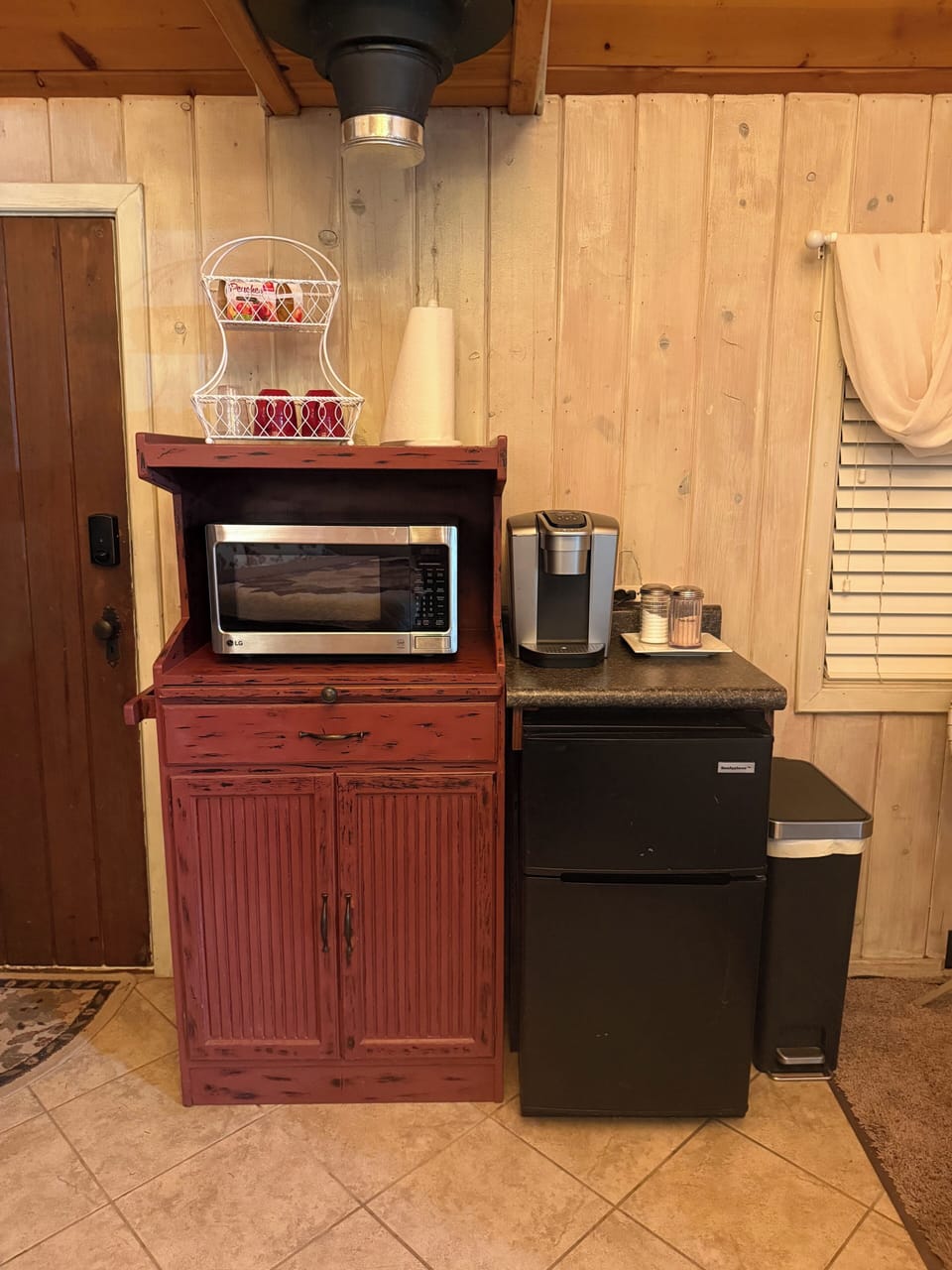 Kitchenette—pull out cutting board, mini-fridge, Keurig, & microwave.