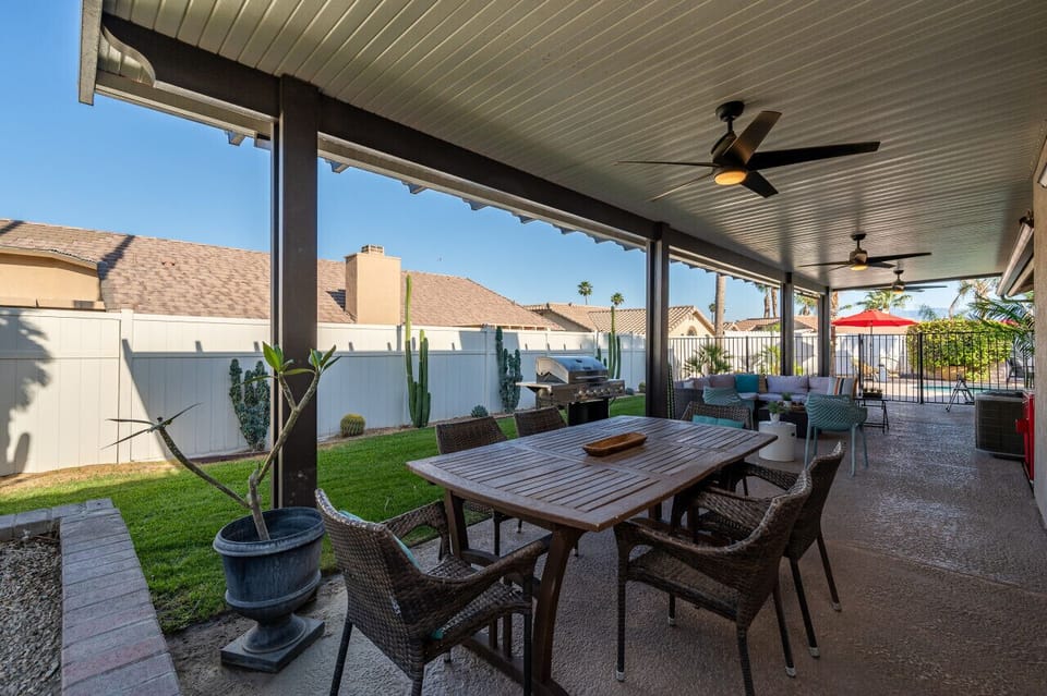 Covered Patio W/ Grill, Dining Table And Lounge Area
