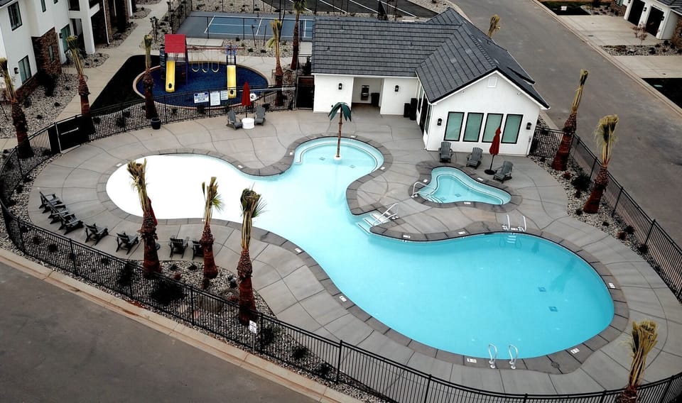 Resort pool, hot tub, and splash pad — fun for kids and relaxing for parents
