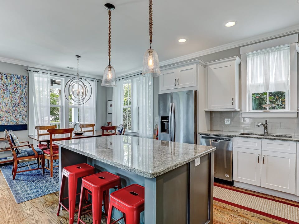 Kitchen features island with seating