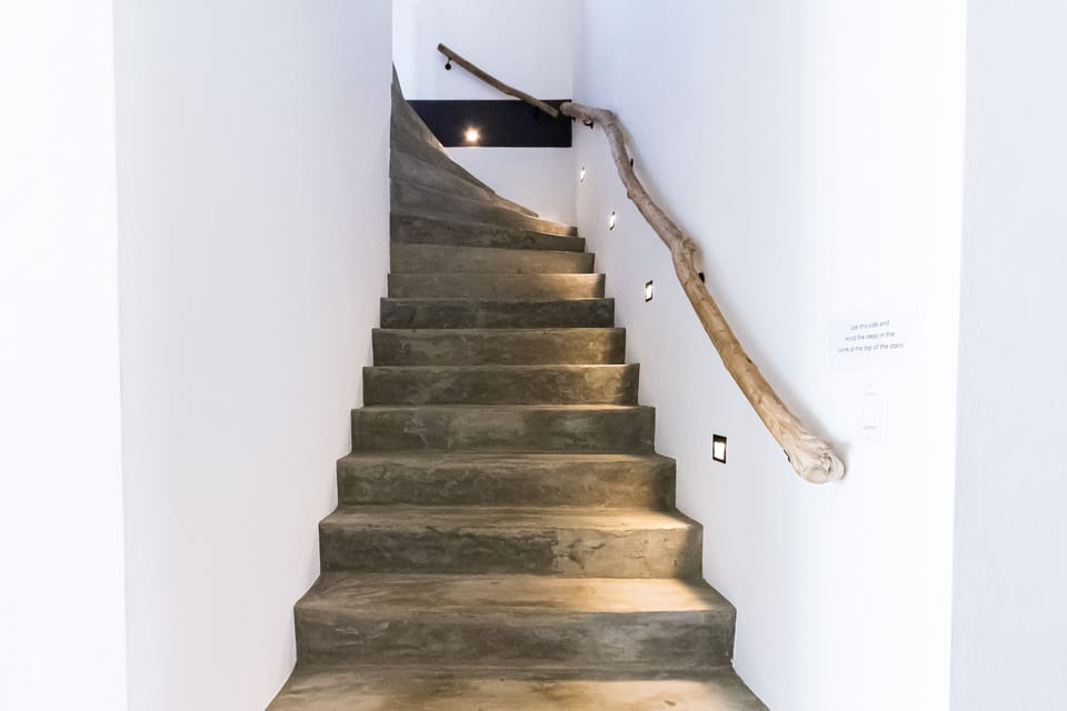Elegant stairs lead gracefully to the second floor, seamlessly connecting the main level to the upper living spaces.