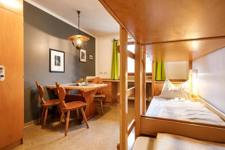Standard Quadruple Room | Desk, bed sheets