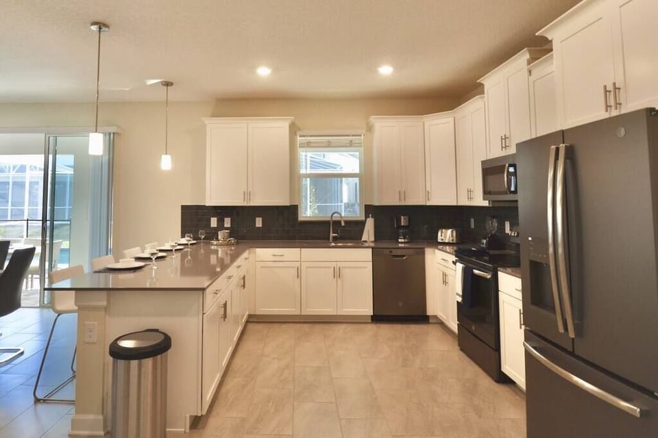 Open kitchen concept with quartz and barstools