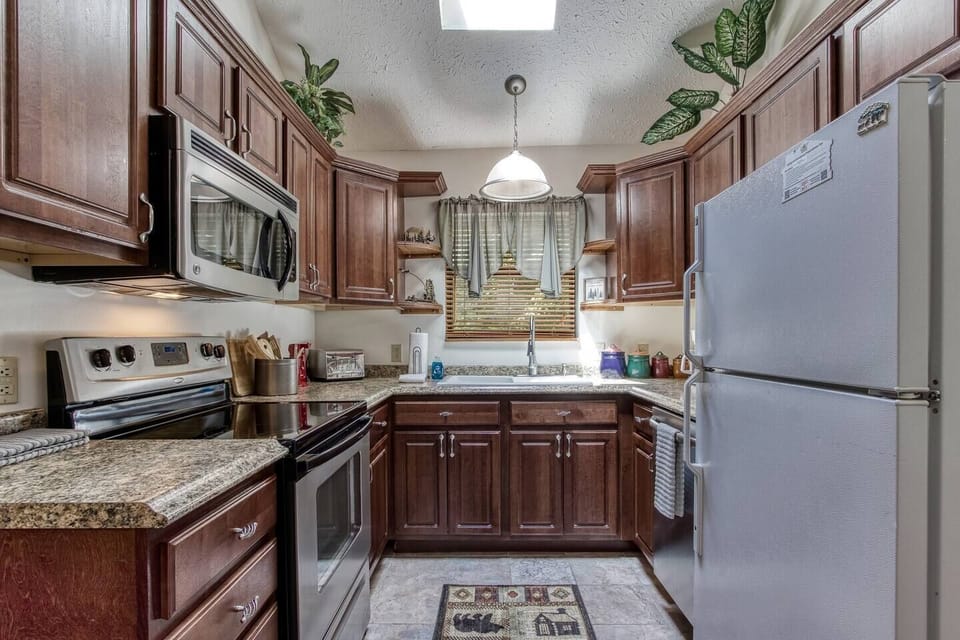 Kitchen fully stocked with all utensils, pots, pans you need for cooking and a coffee maker