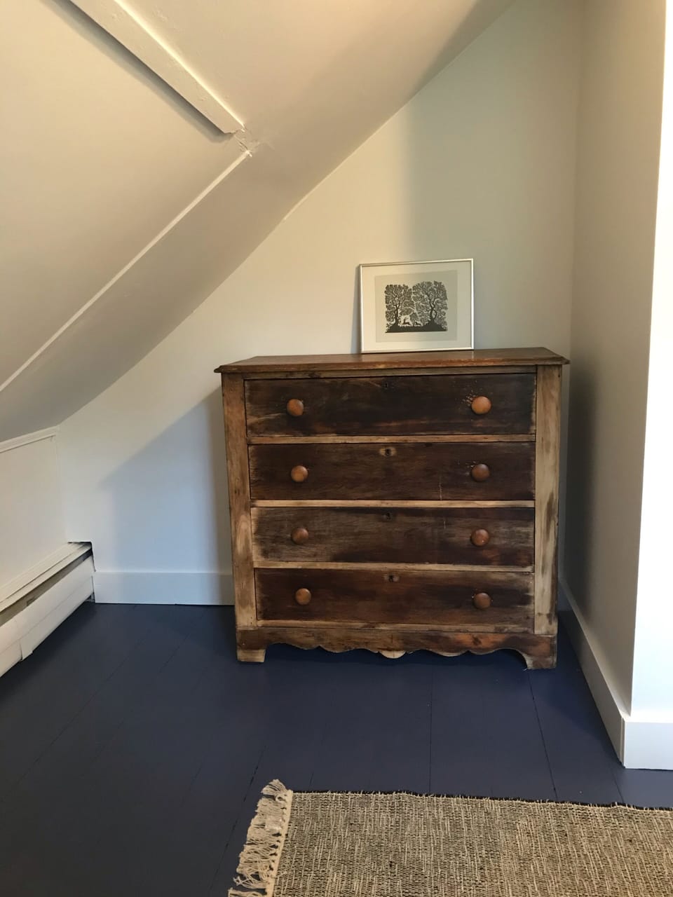Dresser in the upstairs bedroom with twin bed. 