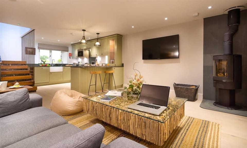 The living room with log burner at Shepherd's View, Lake District