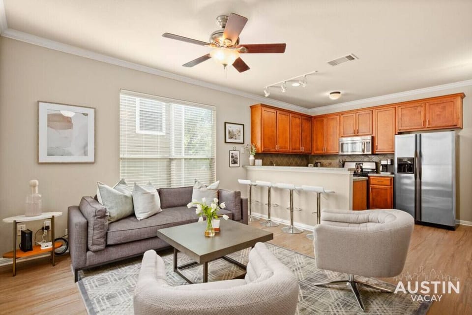 Living room with smart TV and open to the kitchen
