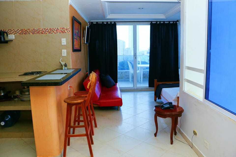 Basic Apartment | Living area | 42-inch flat-screen TV with cable channels, TV, heated floors