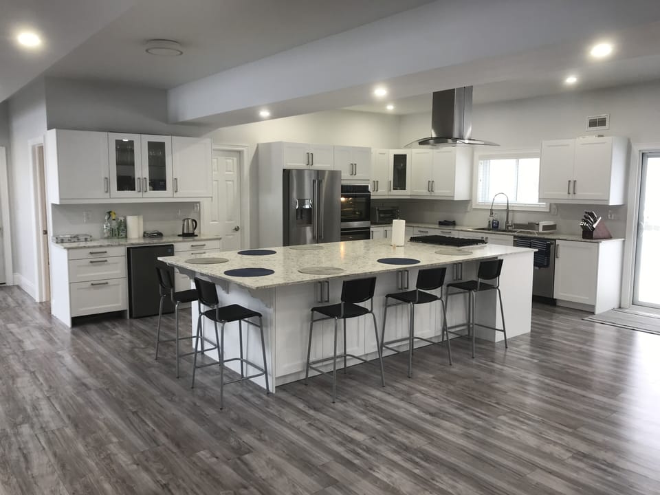 60 sq ft kitchen island which can seat up to 9. Dry bar + additional countertop