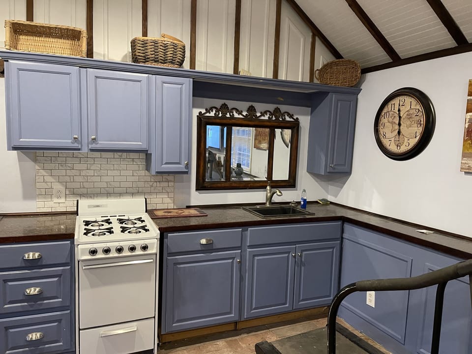 Full kitchen with cookware, dishes, microwave, refrigerator, & more.
