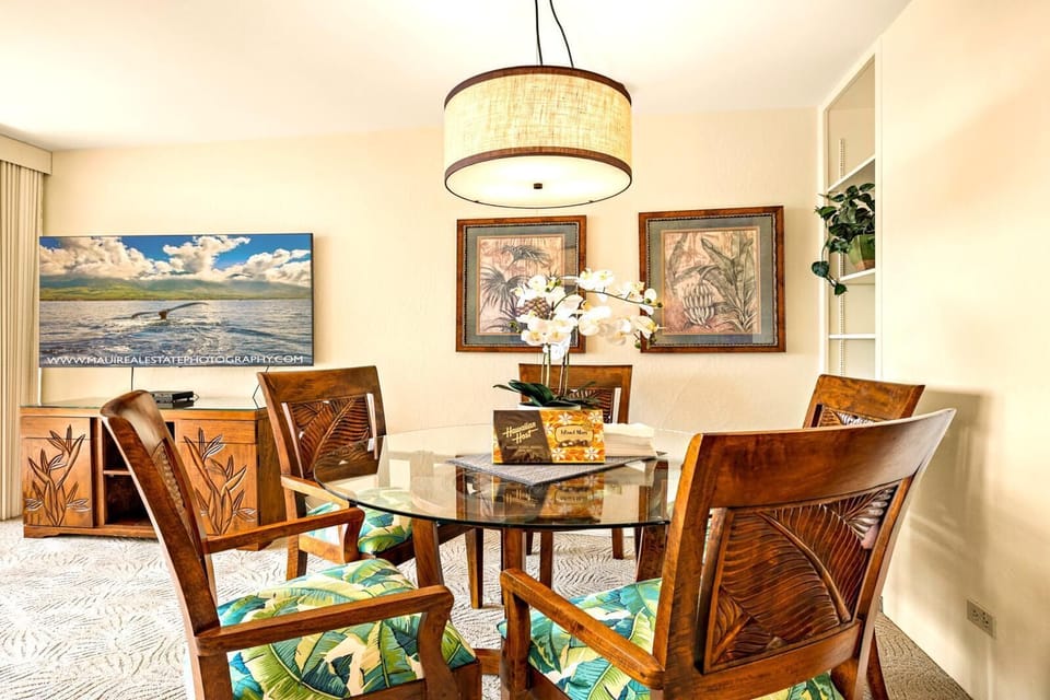 Tropical florals meet wood-carved elegance in this cozy corner where dinner feels like a breezy island celebration    