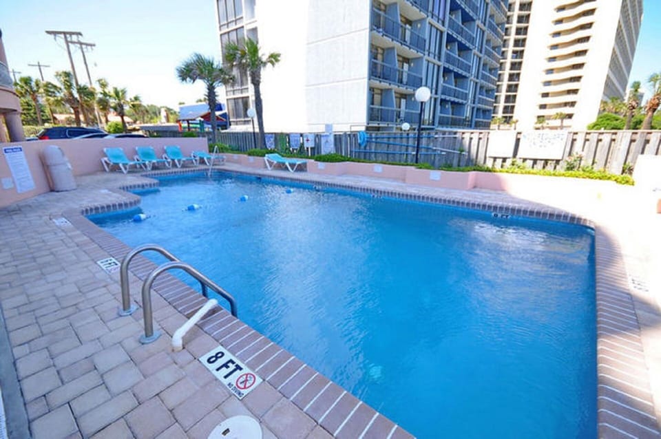 Take a cool dip in the pool after a fun day at the beach.