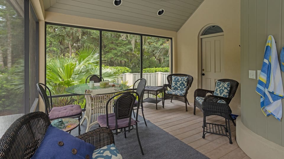 With ample seating, a dining table, and views of the tropical landscape, it's a perfect spot for unwinding after a day at the beach.