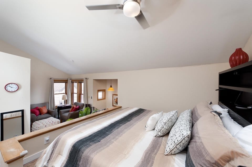King Bedroom Upstairs with Seating Area and Electric Fireplace