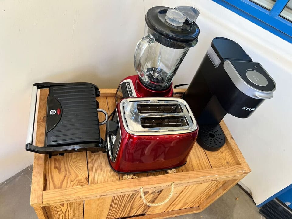Enjoy the convenience of having a toaster, blender, sandwich maker, Keurig + regular drip coffee maker,  electric kettle, microwave and mini fridge (not pictured)