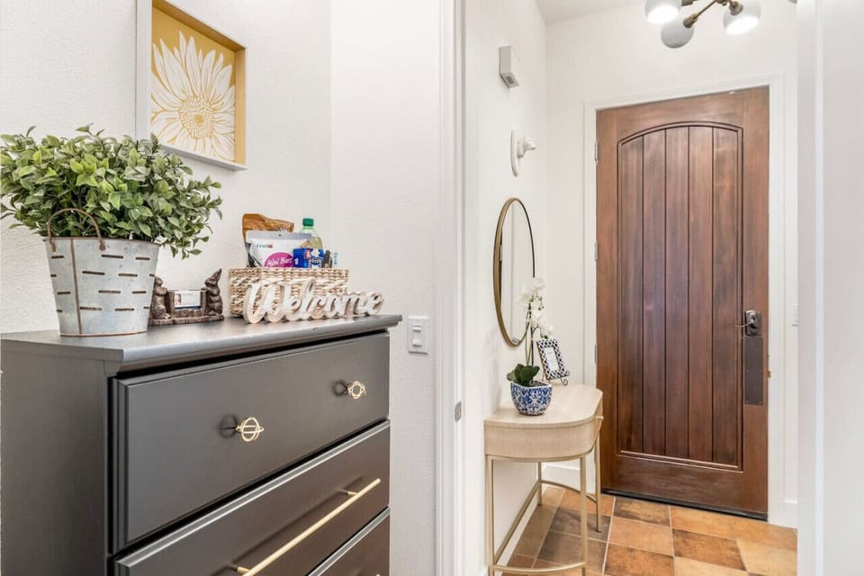Dresser for extra storage and a complimentary basket full of goodies to  satisfy the hungry traveler...