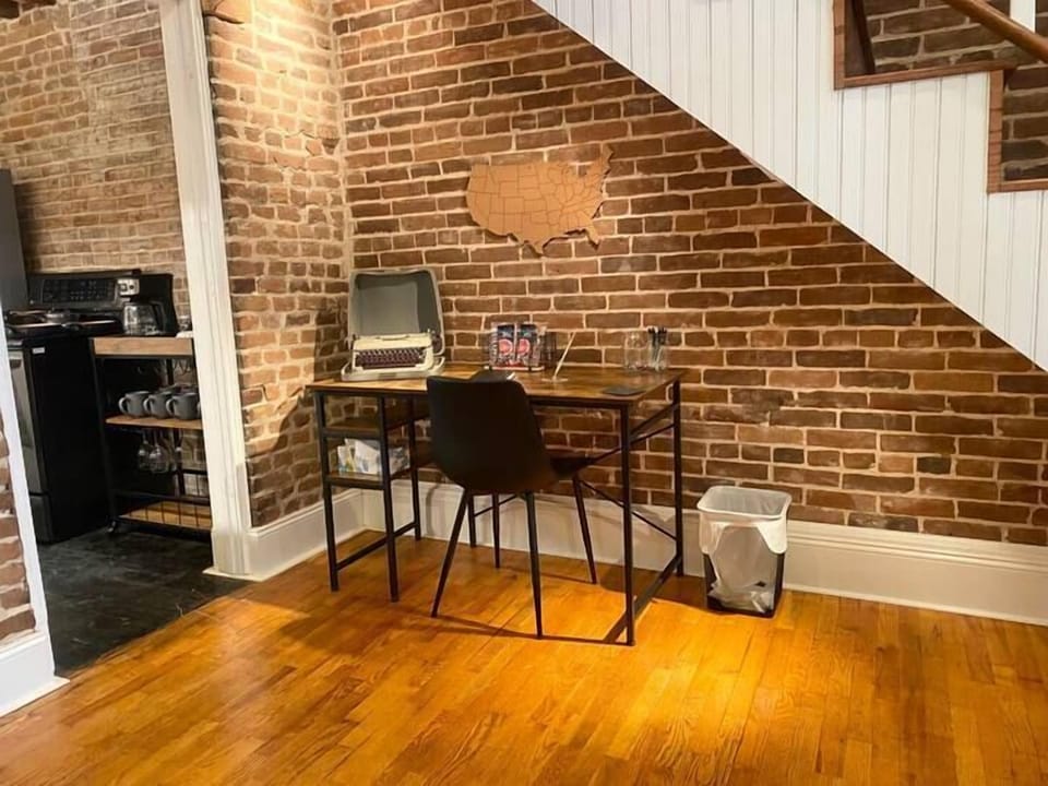 Desk space for working travelers with beautiful lighting to illuminate the brick. 